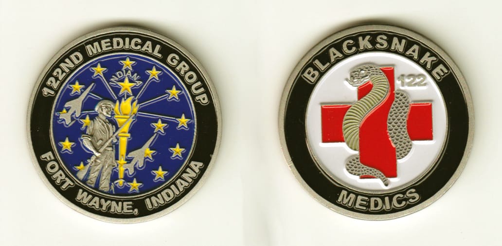 Round shaped, silver colored coin, 1-3/4 inches in diameter.