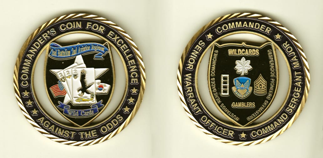 Round shaped, gold colored coin, 2-1/2 inches in diameter.