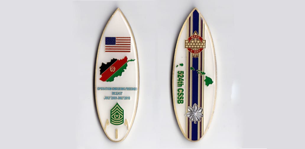 Surf board shaped, off white colored coin, 1 inch wide x 3-1/4 inches high.