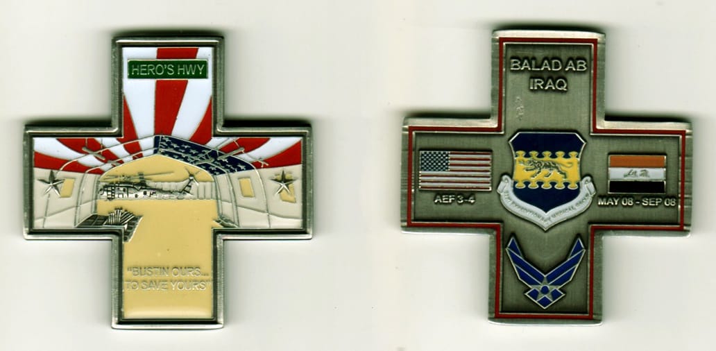 Cross shaped, pewter colored coin, 2 inches wide x 2  inches high.