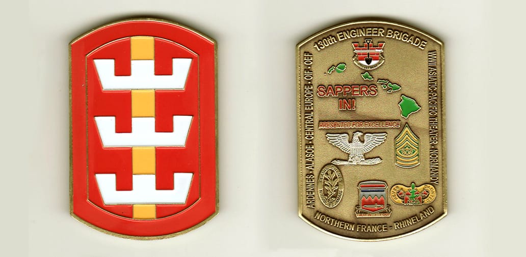 Retangular shaped with bowed top and bottom, brass colored coin, 1-3/4 inches wide x 2-1/2 inches high.