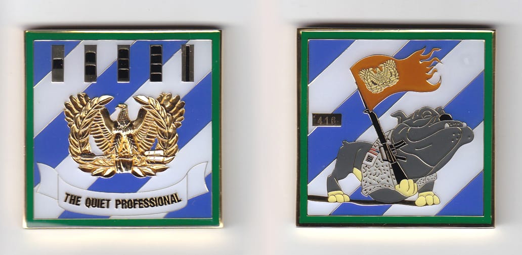 Square shaped, gold colored coin, 2 inches wide x 2 inches high.