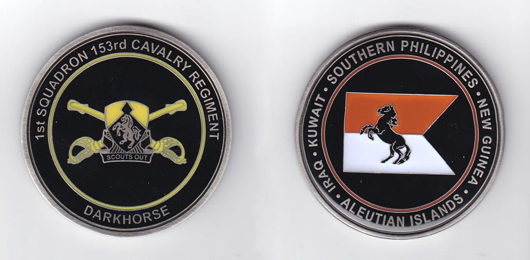 Round shaped, pewter colored coin, 2 inches in diameter.