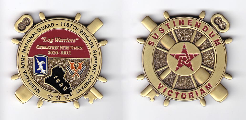 Ship's wheel shaped with crossed key and cannon extended, brass colored coin, 2-1/8 inches in diameter.