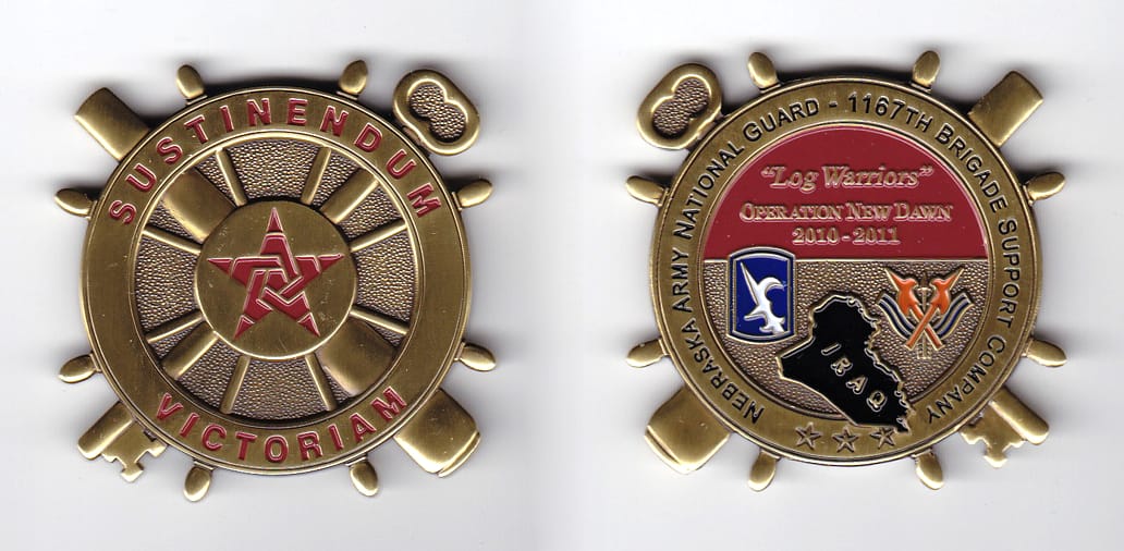 Ship's wheel shaped with crossed key and cannon extended, brass colored coin, 2-1/8 inches in diameter.