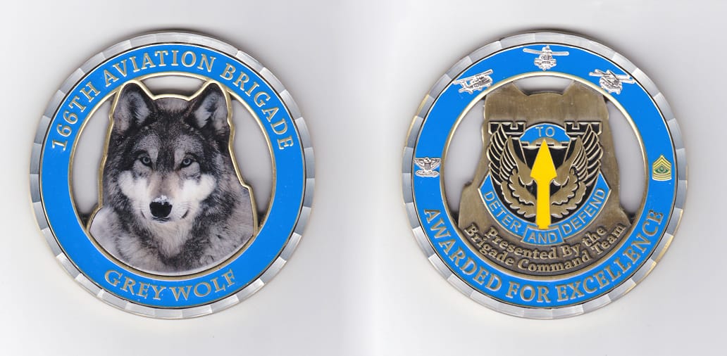 Round shaped, brass colored coin, 3-1/4 inches in diameter.