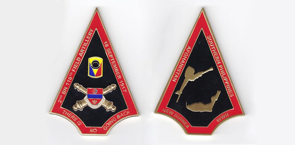 Arrowhead shaped, brass colored coin, 2-1/2 inches wide x 3-1/2 inches high.