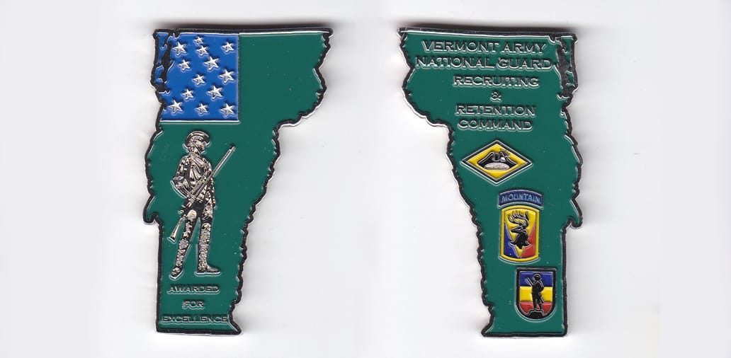 Vermont shaped, silver colored coin, 1-1/2 inches wide x 2-1/2 inches high.