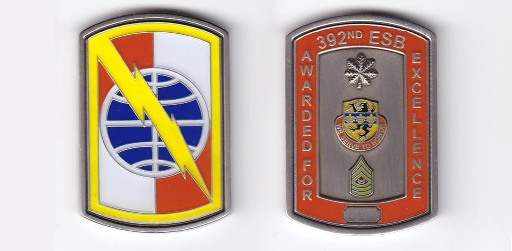 Retangular shaped with bowed top and bottom, pewter colored coin, 1-1/4inches wide x 2 inches high.