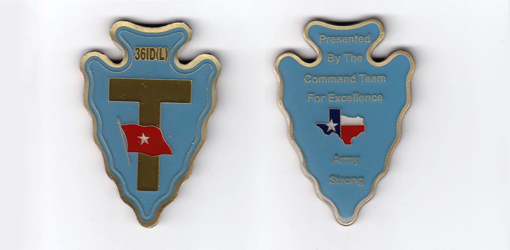 Arrowhead shaped, brass colored coin 1-3/4 inches wide x 2-1/2 inches high.