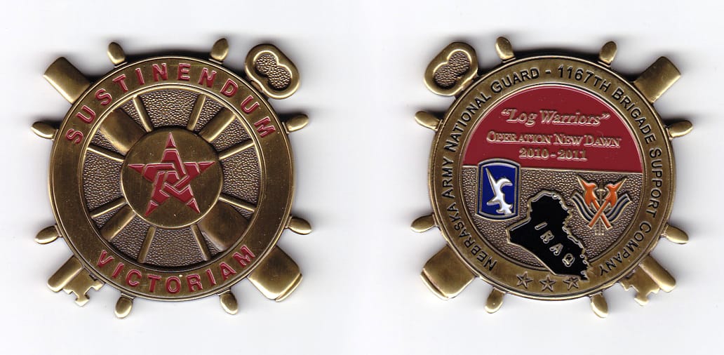 Ship's wheel shaped with crossed key and cannon extended, brass colored coin, 2-1/8 inches in diameter.