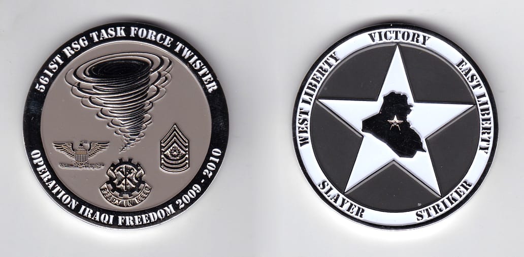 Round shaped, silver colored coin, 2 inches in diameter.