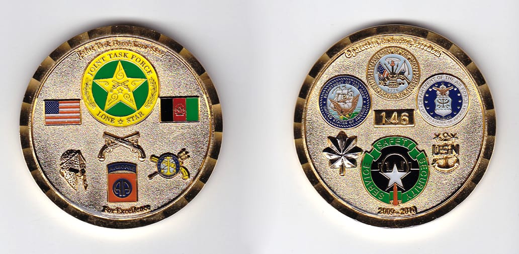 Round shaped, gold colored coin, 2 inches in diameter.