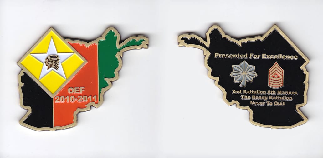 Afghanistan shaped, brass colored coin 2-1/2 inches wide x 2 inches high.