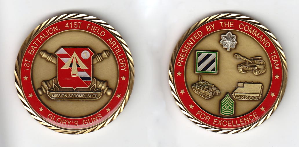 Round shaped, gold colored coin, 2 inches in diameter.