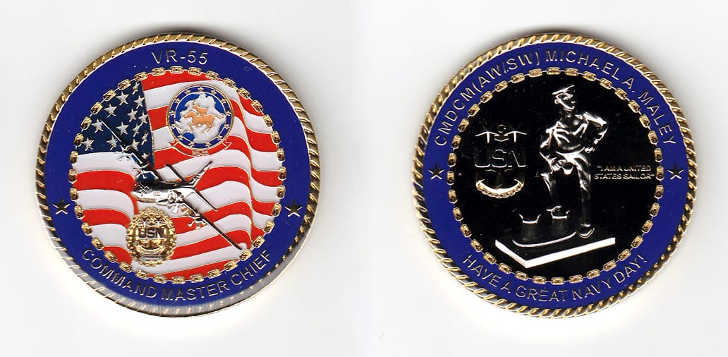 Round shaped, gold colored coin, 2 inches in diameter.