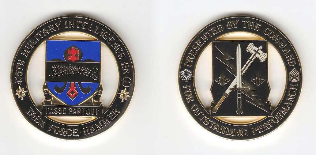 Round shaped, gold colored coin, 2 inches in diameter.