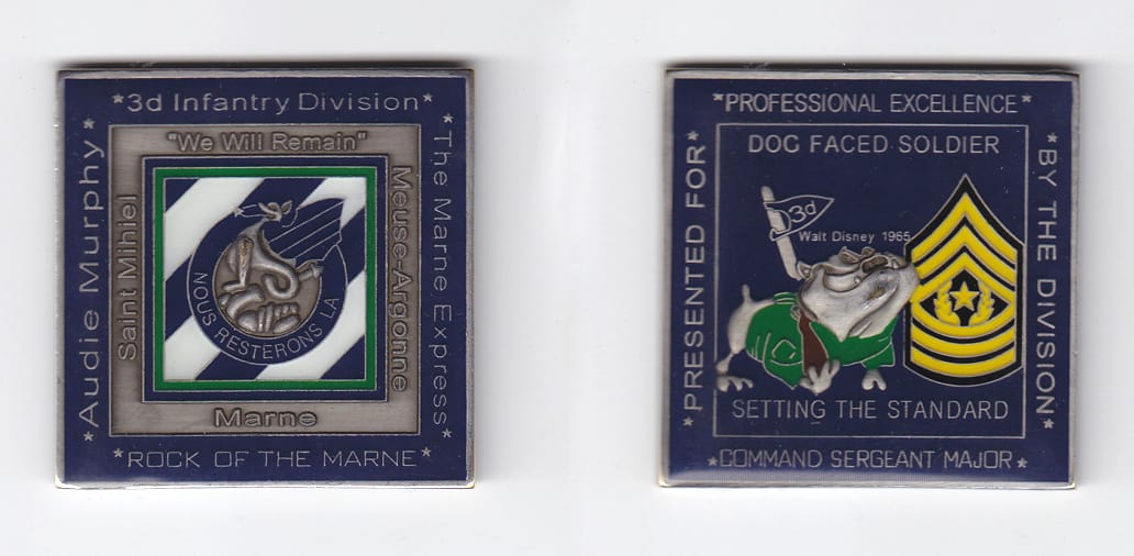 Square shaped, brass colored coin 2 inches wide x 2 inches high.