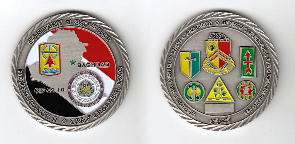 Round shaped, pewter colored coin, 2 inches in diameter.