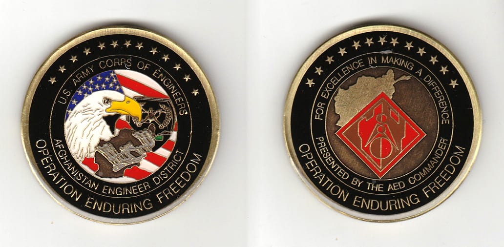 Round shaped, brass colored coin, 2 inches in diameter.