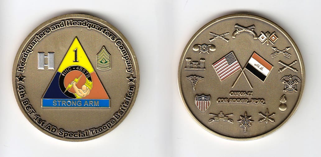 Round shaped, brass colored coin, 2 inches in diameter.