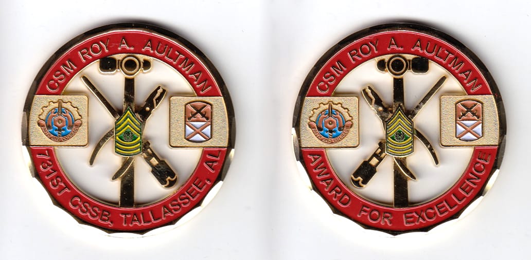 Round shaped, gold colored coin, 2 inches in diameter.