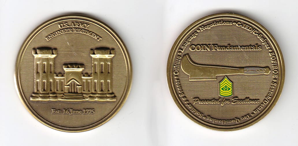 Round shaped, brass colored coin, 2 inches in diameter.