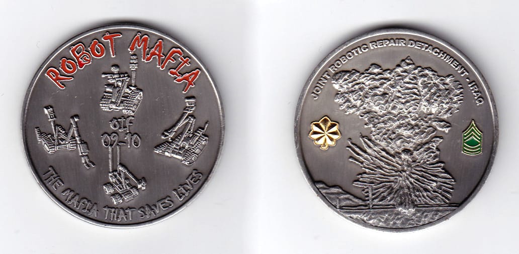 Round shaped, pewter colored coin, 2 inches in diameter.