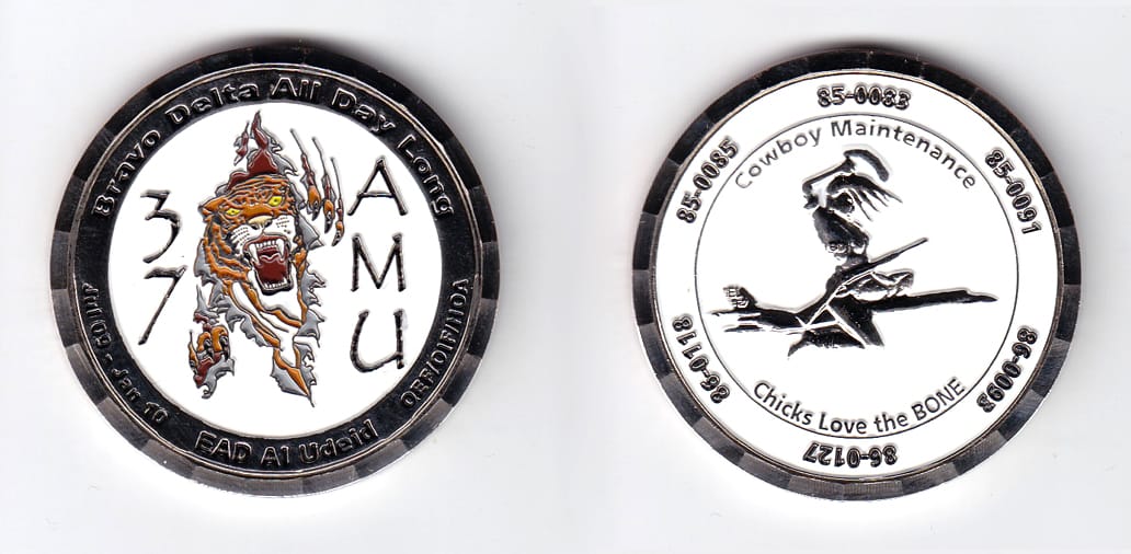 Round shaped, silver colored coin, 2 inches in diameter.