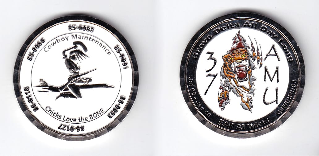 Round shaped, silver colored coin, 2 inches in diameter.