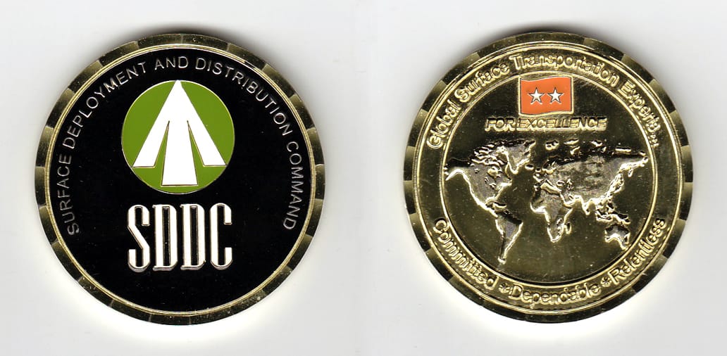 Round shaped, gold colored coin, 2 inches in diameter.