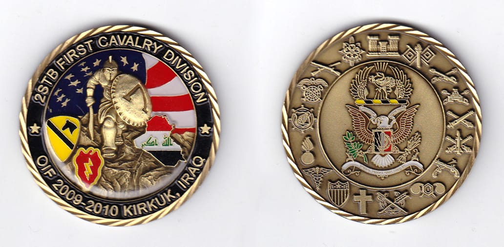 Round shaped, antique brass colored coin, 2 inches in diameter.