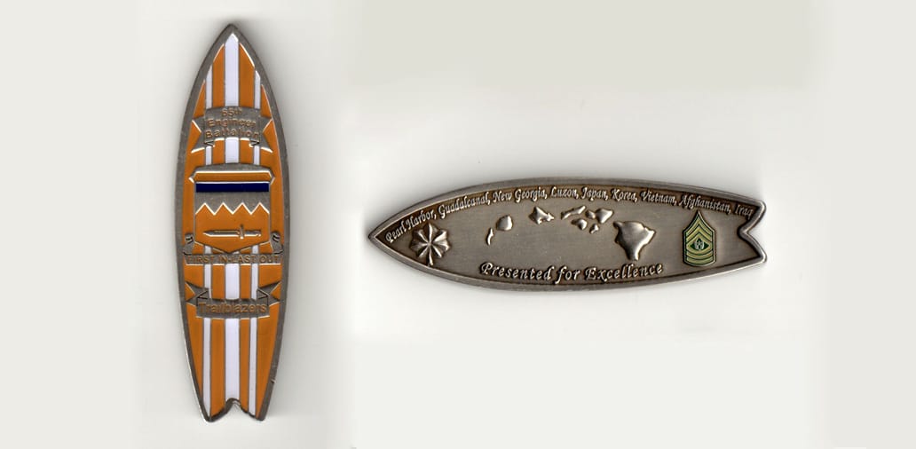 Surf board shaped, pewter colored coin 1 inch wide x 3 inches high.