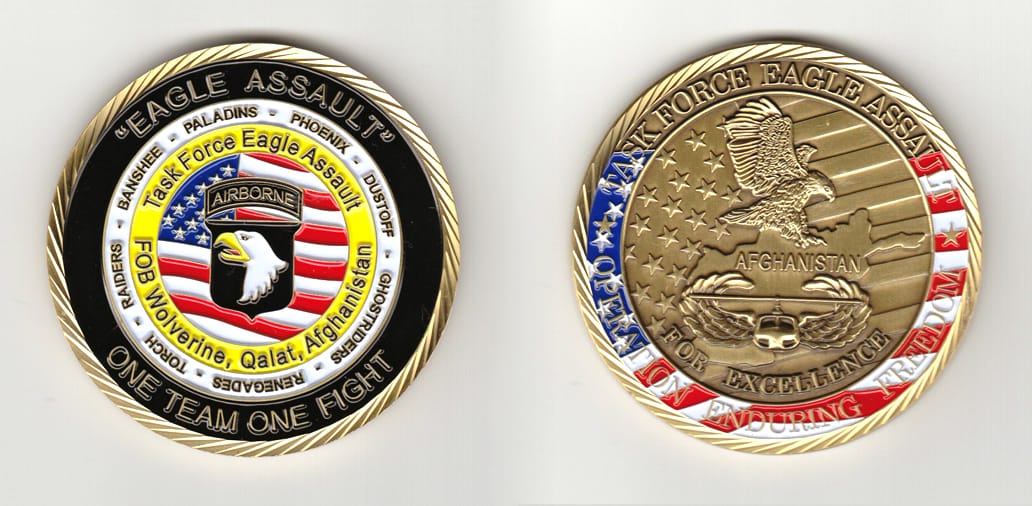 Round shaped, gold colored coin 2-1/2 inches in diameter.