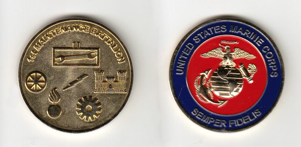 Round shaped, gold colored coin 1-1/2 inches in diameter.