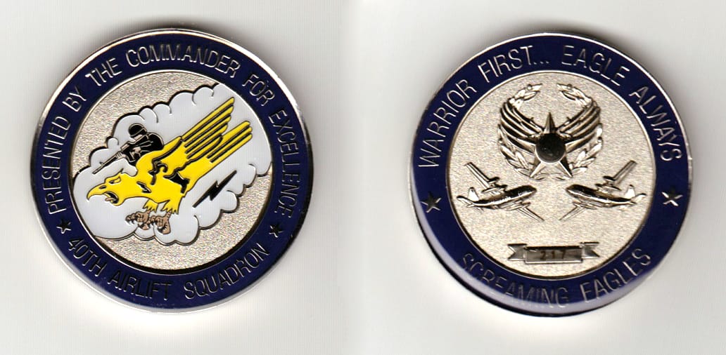 Round shaped, silver colored coin 1-7/8 inches in diameter.