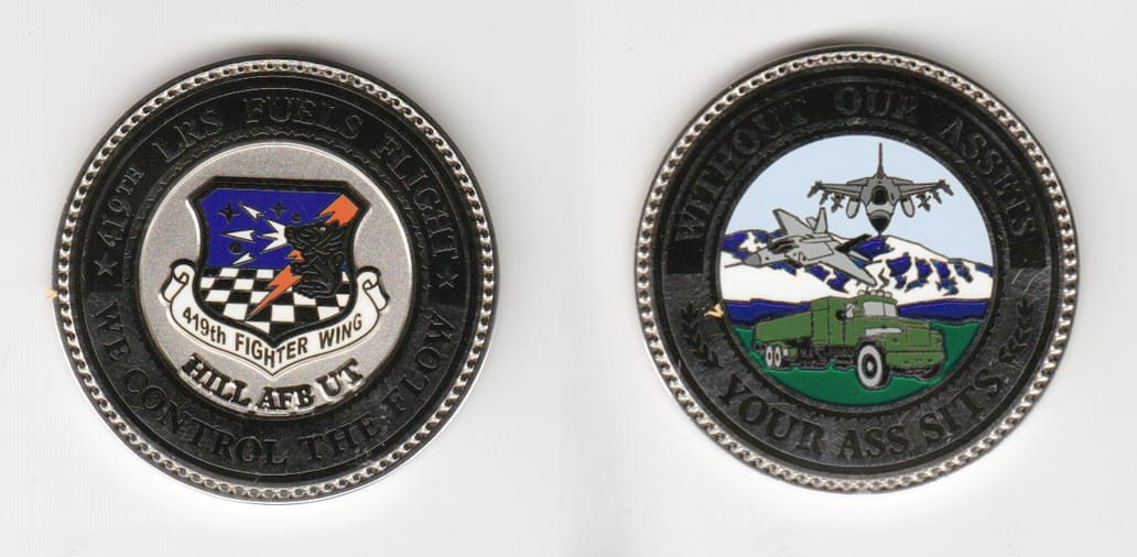 Round shaped, silver colored coin 1-3/4 inches in diameter.