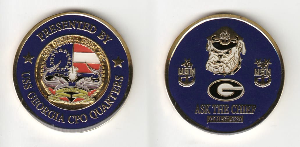 Round shaped, gold colored coin 1-3/4 inches in diameter.