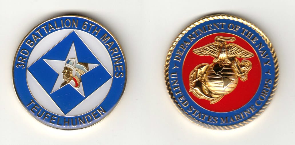 Round shaped, gold colored coin 1-3/4 inches in diameter.