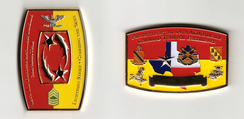 Retangular shaped, gold colored coin 2-1/2 inches wide x 1-1/2 inches high.