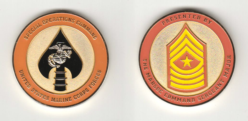 Round shaped, gold colored coin 1-3/4 inches in diameter.