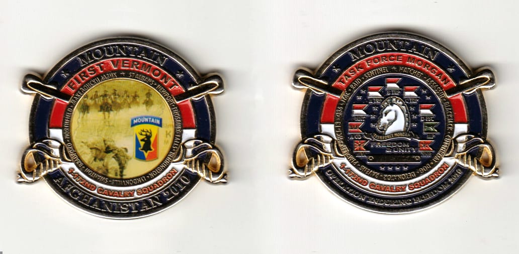 Round shaped with crossed sabers extended, gold colored coin 2 inches wide x 1-3/4 inches high.