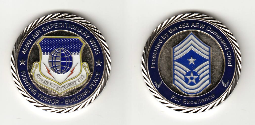 Round shaped, silver colored coin 1-3/8 inches in diameter.