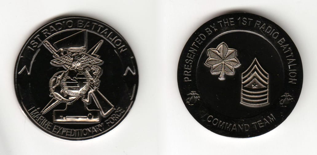 Round shaped, silver colored coin 1-3/4 inches in diameter.