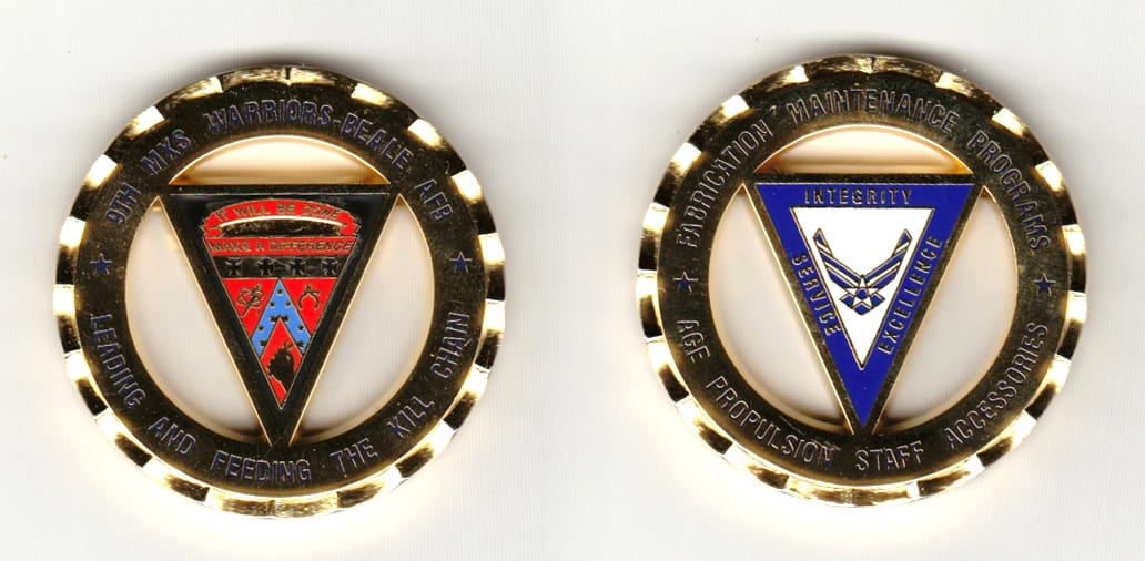 Round shaped, gold colored coin 1-3/4 inches in diameter.