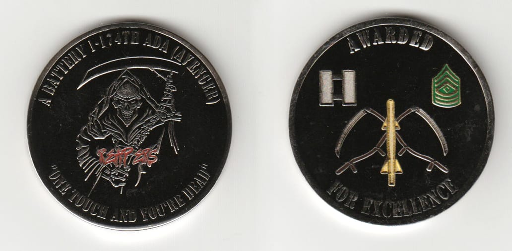 Round shaped, silver colored coin 1-3/4 inches in diameter.