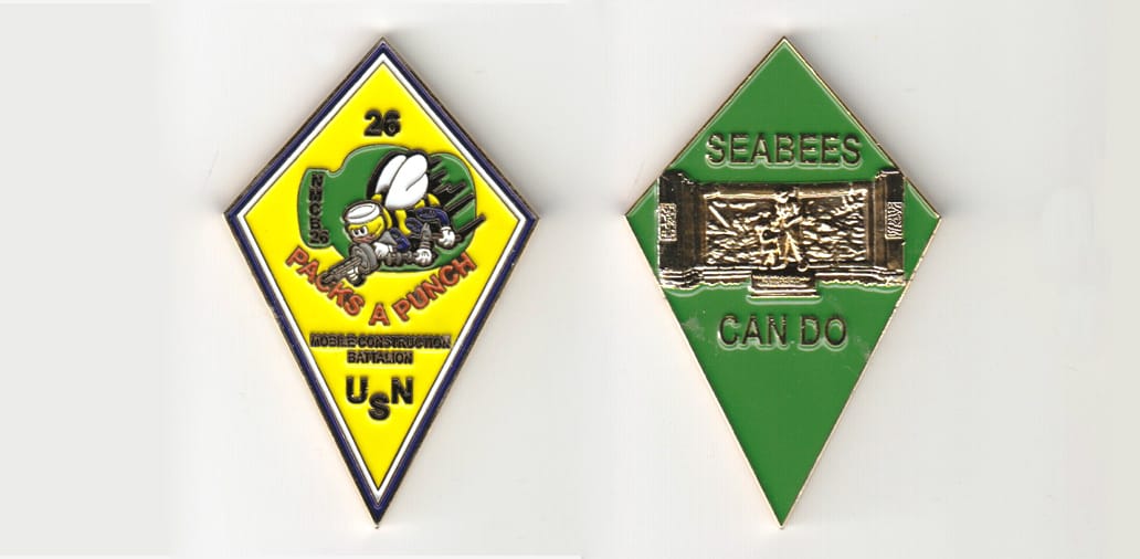 Diamond shaped, gold colored coin 1-1/2 inches wide x 2-1/2 inches high.