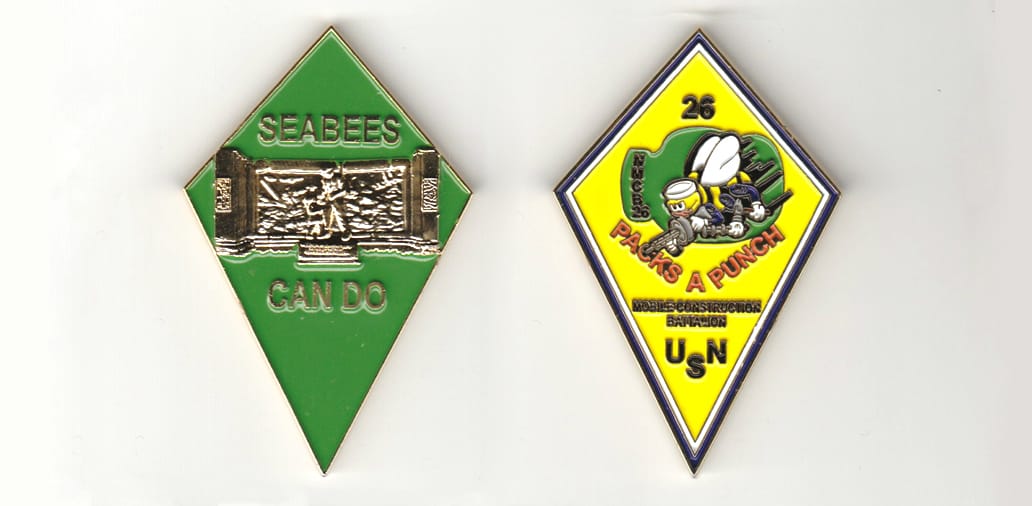 Diamond shaped, gold colored coin 1-1/2 inches wide x 2-1/2 inches high.