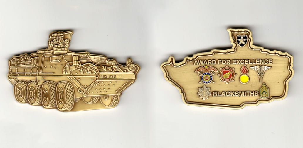 Armored vehicle shaped, brass colored coin 3 inches wide x           1-13/16 inches high.