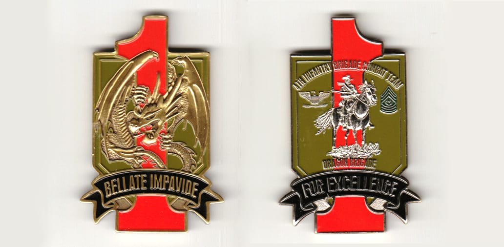 Shield shaped, with banner mounted beneath and the number 1 extending top and bottom, brass colored coin 1-3/4 inches wi...